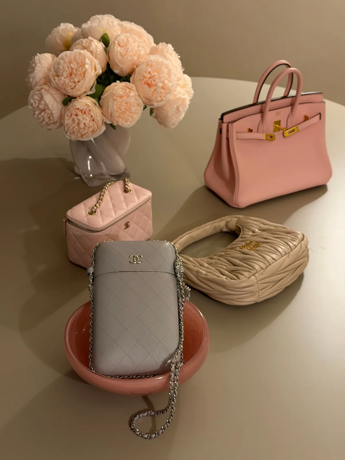 Pastel bags and small accessories with pale peonies
